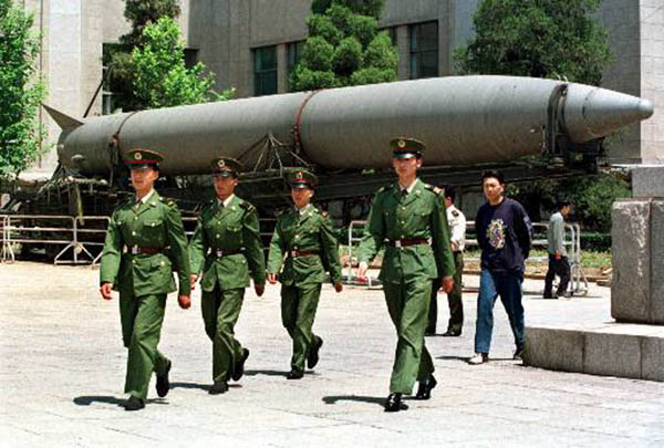 Chinese soldiers march past a missile on display at Beijing's Military Museum Tuesday May 25, 1999. China rejected U.S. allegations Tuesday that it bolstered its nuclear arsenal by pilfering U.S. military secrets, saying Beijing has never stolen classified material from any foreign country. A U.S. House select committe on Chinese espionage claims China stole nuclear weapons secrets from the U.S. over a 20-year period. (AP Photo/Greg Baker)