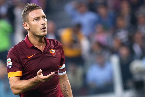 AS Roma forward and captain Francesco Totti reacts during the Italian Serie A football match Juventus Vs AS Roma on October 5, 2014 at Juventus Stadium in Turin.  AFP PHOTO / MARCO BERTORELLO        (Photo credit should read MARCO BERTORELLO/AFP/Getty Images)