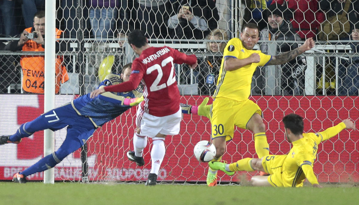 Manchester United's Henrikh Mkhitaryan, centre, scores a goal during the Europa League round of 16 first leg soccer match between Rostov and Manchester United in Rostov-on-Don, Russia, Thursday, March 9, 2017. (AP Photo/Denis Tyrin)