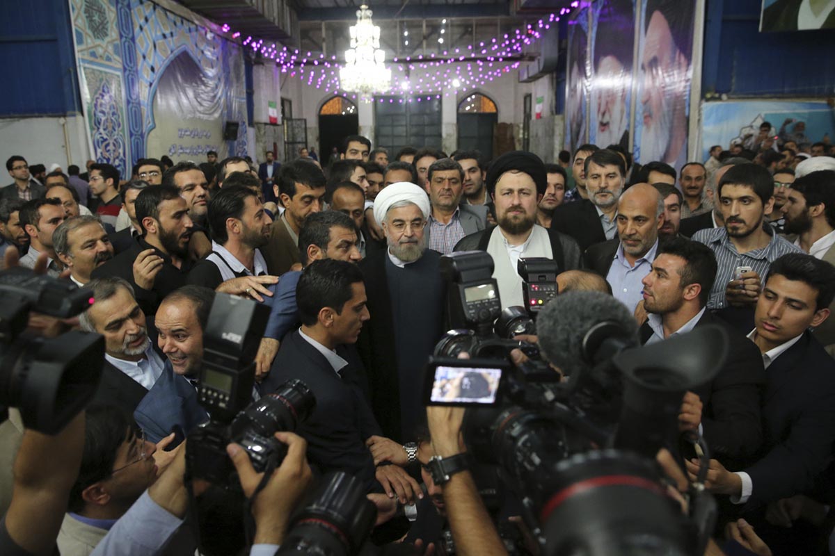 Iranian President-elect Hassan Rohani (C) speaks to the media following a visit to the Khomeini mausoleum in Tehran June 16, 2013. Reuters/Fars News/Seyed Hassan Mousavi (IRAN - Tags: POLITICS) ATTENTION EDITORS - THIS IMAGE WAS PROVIDED BY A THIRD PARTY. FOR EDITORIAL USE ONLY. NOT FOR SALE FOR MARKETING OR ADVERTISING CAMPAIGNS. THIS PICTURE IS DISTRIBUTED EXACTLY AS RECEIVED BY REUTERS, AS A SERVICE TO CLIENTS ORG XMIT: CJF01