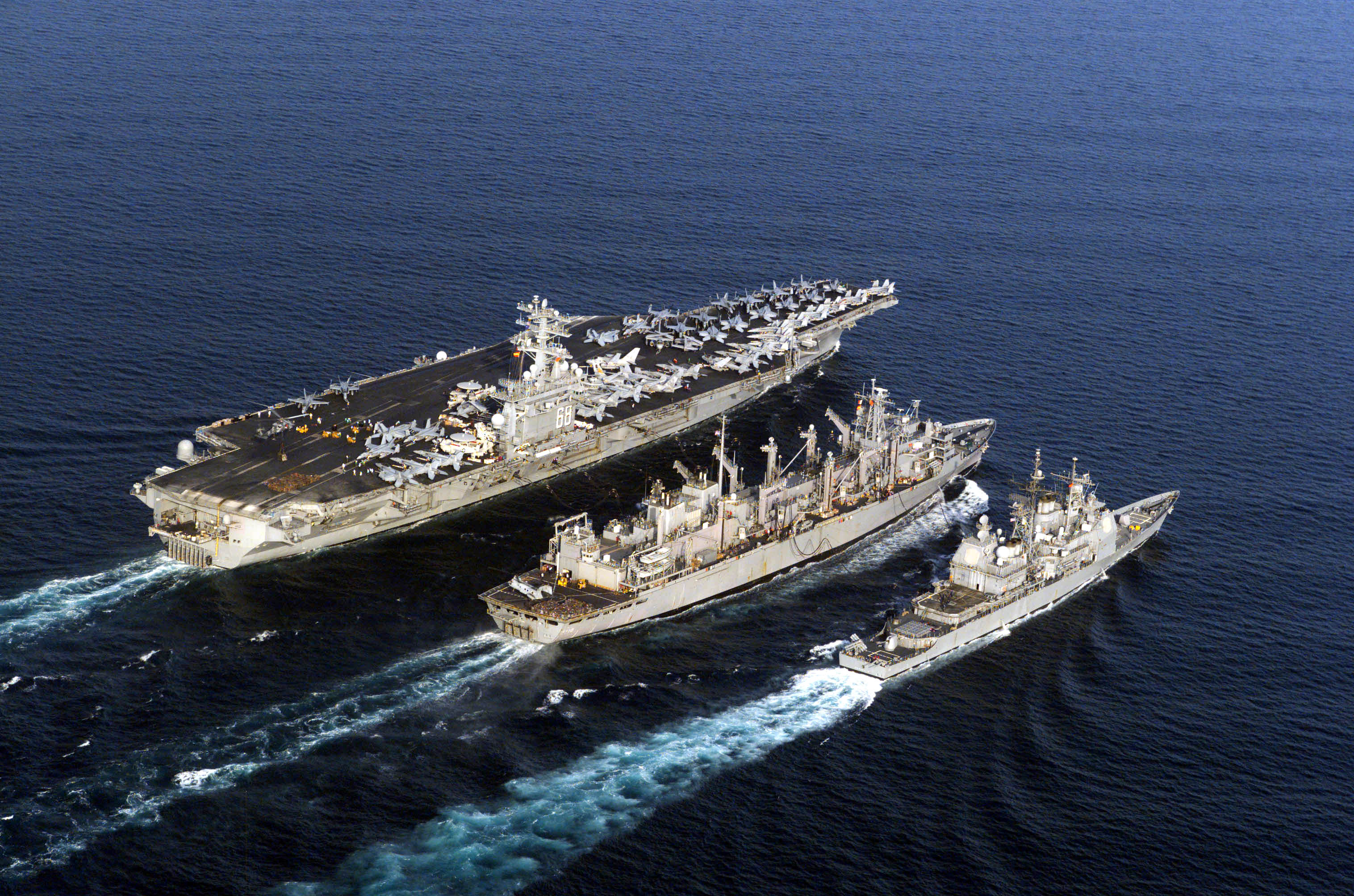 030410-N-1974E-006 The Arabian Gulf (Apr. 10, 2003) -- The aircraft carrier USS Nimitz (CVN 68), guided missile cruiser USS Princeton (CG 59), and fast combat support ship USS Bridge (AOE 10) participate in an underway replenishment (UNREP) while deployed in support of Operation Iraqi Freedom. Operation Iraqi Freedom is the multi-national coalition effort to liberate the Iraqi people, eliminate IraqÕs weapons of mass destruction, and end the regime of Saddam Hussein. U.S. Navy photo by PhotographerÕs Mate 3rd Class Kristi Earl. (RELEASED)